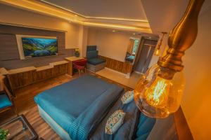 a bedroom with a bed and a desk in a room at Singhs BnB by Lazy Getaways in Shimla