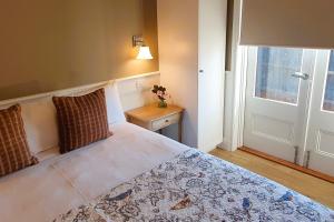 a bedroom with a bed and a window and a door at Scenic Marysville in Marysville