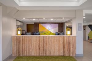 a lobby with a reception desk in a building at Spark by Hilton Fishkill in Fishkill