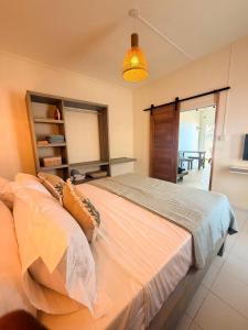 a bedroom with a large bed in a room at Lakaz Riviere Banane in Trèfles
