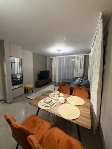 a living room with a table and chairs and a couch at Fresh SPA Relax Velingrad in Velingrad