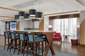 a conference room with a table and chairs at Hampton Inn Lake Charles in Lake Charles