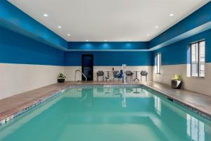 a pool in a hotel room with blue walls at Hampton Inn Lake Charles in Lake Charles