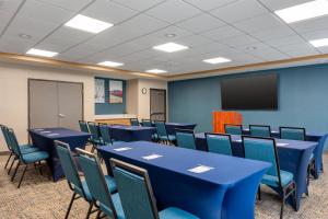 a conference room with blue tables and chairs and a screen at Hampton Inn Lake Charles in Lake Charles +27 photos