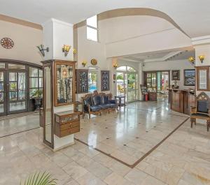 a large living room filled with furniture and windows at Hotel Sinatra - All Inclusive in Kemer +52 photos