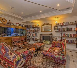 a living room filled with furniture and a fireplace at Hotel Sinatra - All Inclusive in Kemer