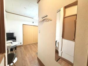 an office with a hallway with a table and chairs at Nogata RelaxingHome E2 in Tokyo
