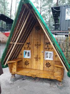 a small wooden house with spiders on it at Mi Familia CAMP in San Felipe