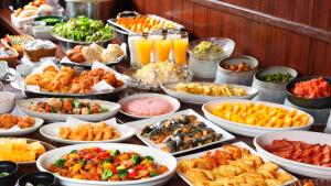 a buffet with many different types of food on a table at Hotel Route-Inn Gotenba Eki-Minami in Gotemba