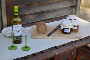 a table with a bottle of wine and two glasses at B&B L'Eau Claire in La Hulpe +18 photos