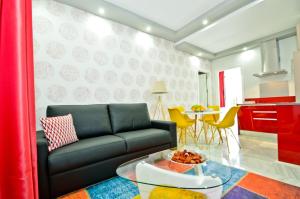 Ein Sitzbereich in der Unterkunft The Zentral Arenal Suites