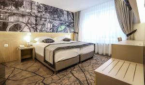 Letto o letti in una camera di Hotel Grad