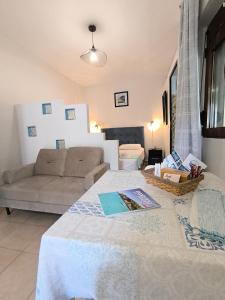 a living room with a couch and a table at Poseidon Apartments in Gaios