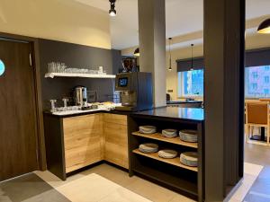 a kitchen with a counter with plates on it at ANPELA in Rýmařov