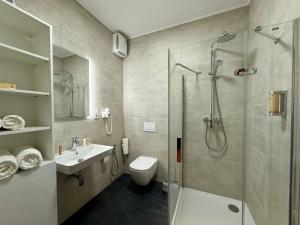 a bathroom with a shower and a toilet and a sink at ANPELA in Rýmařov +33 photos