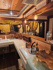a kitchen with a tea kettle on a counter at Guest House時音 in Joetsu