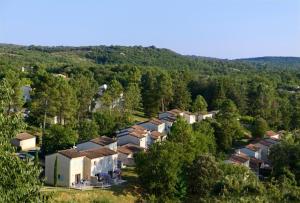 an aerial view of a village in the forest at Appartement dans résidences de vacances in Salavas