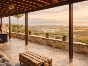 a patio with a bench and a view at Filia Garden in Samos