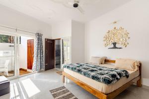 a bedroom with a bed in a room at Baidehi Cottage in Rishīkesh