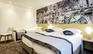 Letto o letti in una camera di Hotel Grad