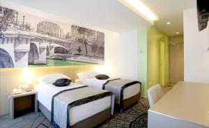 Letto o letti in una camera di Hotel Grad