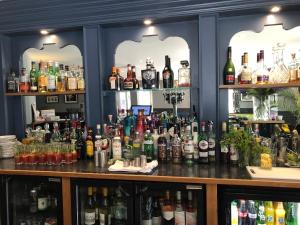 a bar filled with lots of bottles of alcohol at Albert Cottage Hotel in East Cowes