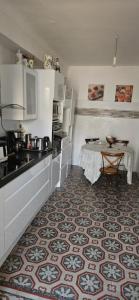a kitchen with a sink and a table in it at Villa Nanou Riviera in Nice +11 photos