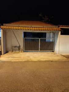 a building with a gate on the side of it at Tipika Guest House - di Pasir Pekan sempadan 3 Daerah KB, Pasir Mas & Tumpat in Tumpat