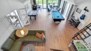 an overhead view of a living room with a pool table at Villavilla 546 - Hostrup Strand, Limfjorden in Spottrup