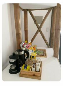 a table with a coffee maker and a tray of food at Ocam Ocam Bayside Lodge in Busuanga +16 photos