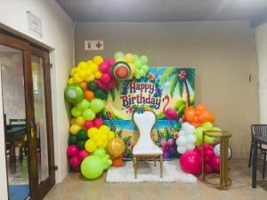 a balloon wall with a happy birthday sign and a bunch of balloons at Ulifalodge & functions in Durban +12 photos