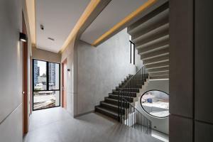 a staircase in a house with a window at Cove Alexa in Jakarta
