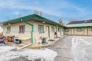 a building with a picnic table in front of it at Bel Aire Motel Chamberlain Near Missouri River I 90 in Chamberlain