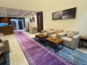 a lobby with couches and tables in a building at المهيدب للشقق المخدومه 2 in Al Ahsa