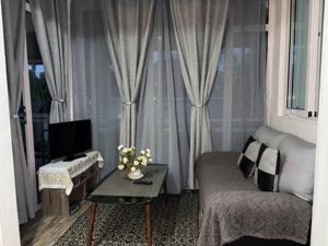 a living room with a couch and a tv at Villa Capri first floor in Quatre Bornes +36 photos