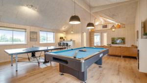 two ping pong tables in a large room at Villavilla 474 - Grenå Strand, Østjylland in Grenå +19 photos
