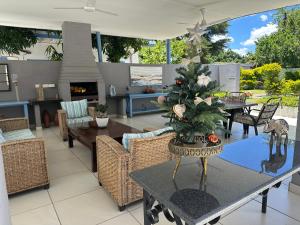 a living room with a table with a christmas tree on it at Aflica Apartments in Gaborone