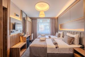 a hotel room with two beds and a television at Best House Hotel OLD TOWN in Istanbul +42 photos