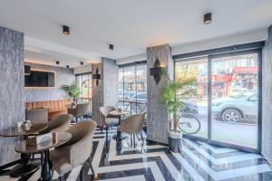 a restaurant with tables and chairs and a window at Best House Hotel OLD TOWN in Istanbul