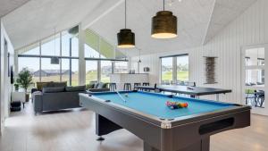 a living room with a pool table in it at Villavilla 530 - Mommark, Sydjylland in Sarup +20 photos