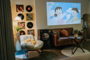 a living room with a couch and a chair at Dubai House in Hanoi