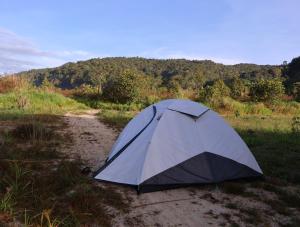 a tent sitting on the side of a dirt road at Ditrek Adventure in Ðại Lào