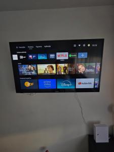 a flat screen tv hanging on a wall at Studio apartman Tara in Kutina +13 photos