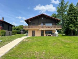 a house with a large lawn in front of it at Haus 44 Feldblick in Arrach
