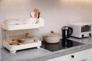 a kitchen with a counter top with a microwave at KNV Apartment in Thu Dau Mot +2 photos