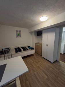 a small room with a bed and a table at Apartment in Freimersheim