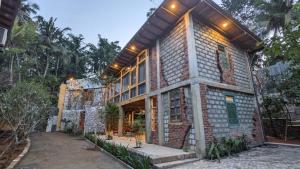 a brick house with lights on top of it at Barren House in Hiriketiya