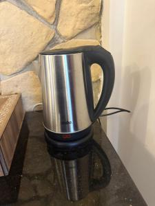 a coffee pot sitting on top of a counter at Harran Kümbet Otel in Harran