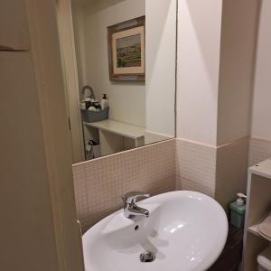 a white sink in a bathroom with a mirror at I 3 FRATELLI in Foligno +14 photos