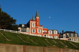an orange and black building on top of a hill at La Baie l étoile in Boismont